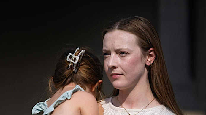 A 16x9 version of the image that includes the woman&rsquo;s face.